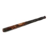 A Victorian turned wooden and painted police truncheon, 46cms long.