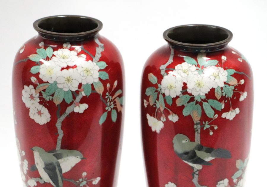 A pair of large Japanese cloisonne vases decorated with birds and flowers, on a red ground, 38cms - Image 2 of 6