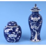 A Chinese blue & white prunus vase and cover, 26cms high, together with a blue & white prunus ginger