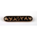 A Victorian black enamel and gold (unmarked but tested as 9ct) mourning bar brooch, 10.8g.