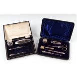 A George V silver six-piece manicure set, Birmingham 1910, cased; together with a similar five-piece