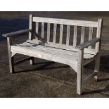 A slatted wooden garden bench, 128cms wide.