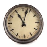 An early 20th century Magneta electric wall clock, 37cms diameter.