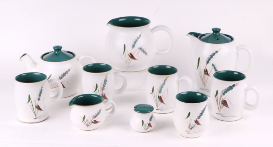 A quantity of assorted Denby Green Wheat table wares to include teapot, water jug and milk jug;