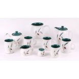 A quantity of assorted Denby Green Wheat table wares to include teapot, water jug and milk jug;