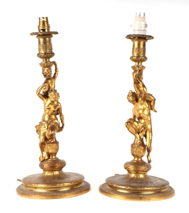 A pair of gilt bronze figural table lamps, the columns in the form of neo-classical figures, each