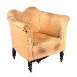 An Edwardian upholstered tub armchair.