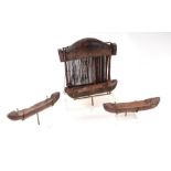 A 19th century wooden hand loom and shuttles, mounted on Perspex display stands, ex Andrew Crawforth