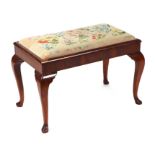 A George II style walnut stool with rectangular tapestry drop-in seat, on cabriole legs