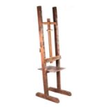 A large floor standing adjustable artist's easel.