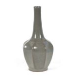 A Chinese crackle ware celadon glaze vase of fluted octagonal form, 22cms high.