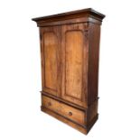 A Victorian mahogany double wardrobe, the moulded cornice above twin panelled doors and single