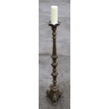 A Gothic Revival large brass ecclesiastical style pricket candlestick, 100cms high.