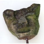 A carved sandstone corbel in the form of a cat, possibly medieval, approx 33cms wide, mounted on a
