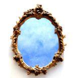 A carved giltwood rococo style wall mirror, 52cms wide together with a rectangular wall mirror (2)