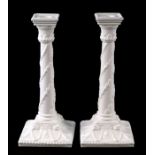 A pair of Royal Worcester porcelain candlesticks, 27cms high (2).