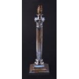 A silver plated Corinthian column table lamp on a square stepped base, 38cms high.