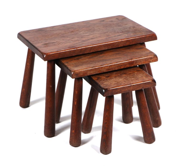 A set of three naive style oak stools, largest 55cms wide (3).