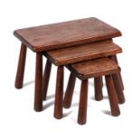 A set of three naive style oak stools, largest 55cms wide (3).