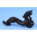 A Chinese stone carving of a stylised dragon, 13cms long.