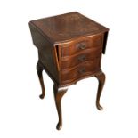 A Queen Anne style serpentine fronted drop-flap chest of drawers of small proportions, the shaped