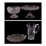 A cut glass footed bowl with hobnail cut decoration, 19cms diameter; together with a similar dish,