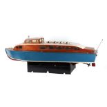 A large 1950's scratch built river cruiser with painted wooden hull, removable cabin section