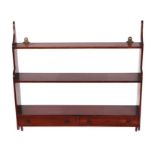 A set of early 20th century mahogany hanging wall shelves with two tiers above two drawers, 65cms