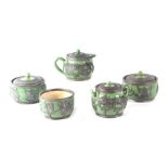 A Chinese part tea set, Hsin Hochen, decorated with dragons in pewter overlay (5).Condition