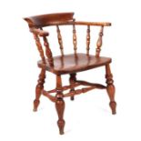 Welsh Interest. A beech and elm Smoker's bow armchair, the back rail showing remains of