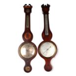 An Edwardian aneroid barometer thermometer and level in a banjo mahogany case, 100cms high; together