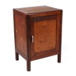 A George IV mahogany cabinet with single panelled door enclosing a shelved interior, on square legs,