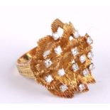 An 18ct gold modern design ring set with fourteen diamonds, approx UK size 'O', 12.9g.