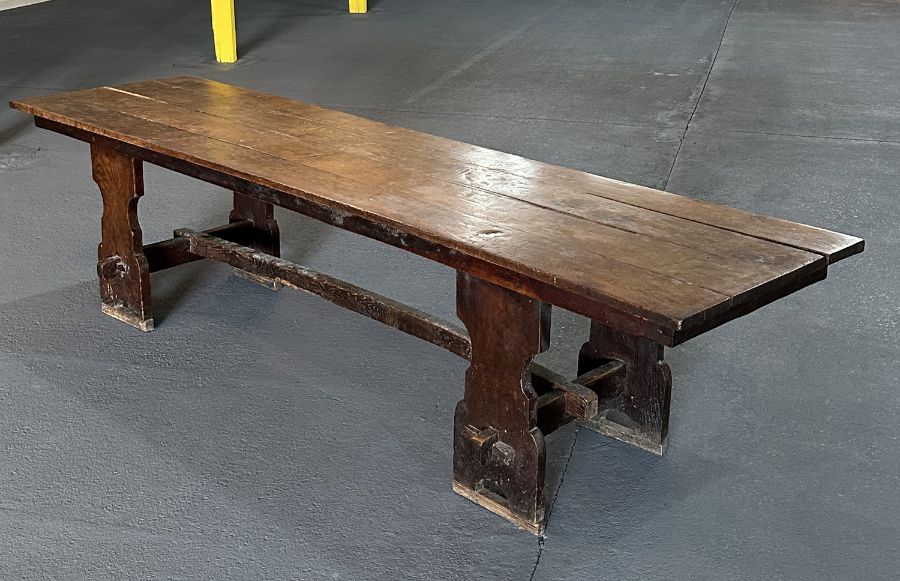 A large 17th century style oak refectory table with four plank top, on trestle supports joined by - Image 3 of 20