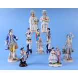 A quantity of continental porcelain and pottery figures to include two nodding figures, the