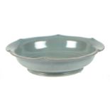 A Chinese crackle ware celadon glaze shallow bowl, 20cms diameter.
