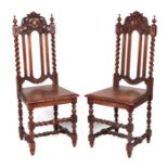 A pair of 19th century oak hall chairs with barleytwist supports and carved solid seats (2).