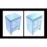 A pair of Julian Chichester modern design mirrored bedside chests, each with three short drawers,