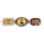 Three small Victorian pin brooches to include garnet set and memorial hair panel examples.