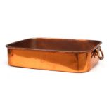 A large 19th century rectangular two-handled copper roasting tray, stamped 'W.S Adams & Son,