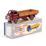 A Dinky Toys no. 408 big Bedford lorry, maroon cab with light tan flatbed and cream hubs, boxed.