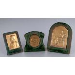 A group of bronze plaques on stands, all signed 'G Devreese', the largest 7.5 by 11.5cms (3).