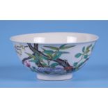 A Chinese famille rose bowl decorated with flowering foliage, blue four character mark to the