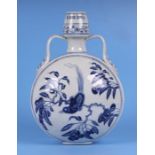 A Chinese blue & white two-handled vase of compressed circular form, decorated with a bird amongst