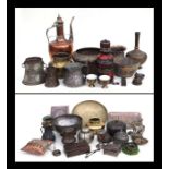 A large quantity of Middle Eastern metalware to include bowls, coffee pots and vases.
