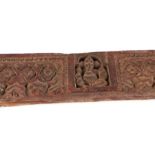 An Indian carved hardwood panel with central figure of Ganesh, 109 by 8cms.