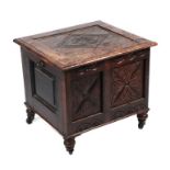 A small 18th century oak coffer with carved decoration and dated ? (reduced in size), 57cms wide.