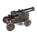 A late 19th century signalling cannon. Having a cast iron barrel 49cms (19.25ins) long with an