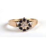 A 9ct gold diamond and sapphire cluster ring, approx UK size 'T', 2.8g.