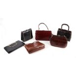 A quantity of vintage leather and faux crocodile ladies handbags, purses and gloves; together with